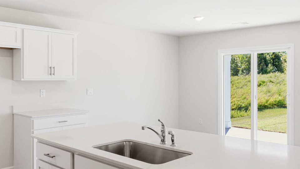 Kitchen with island and cabinets.