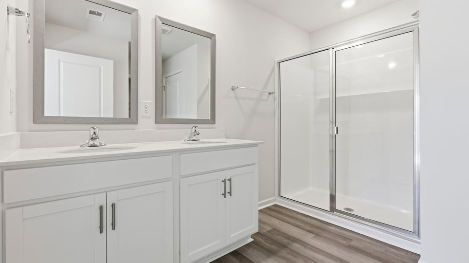 Primary bathroom with double vanity sinks.