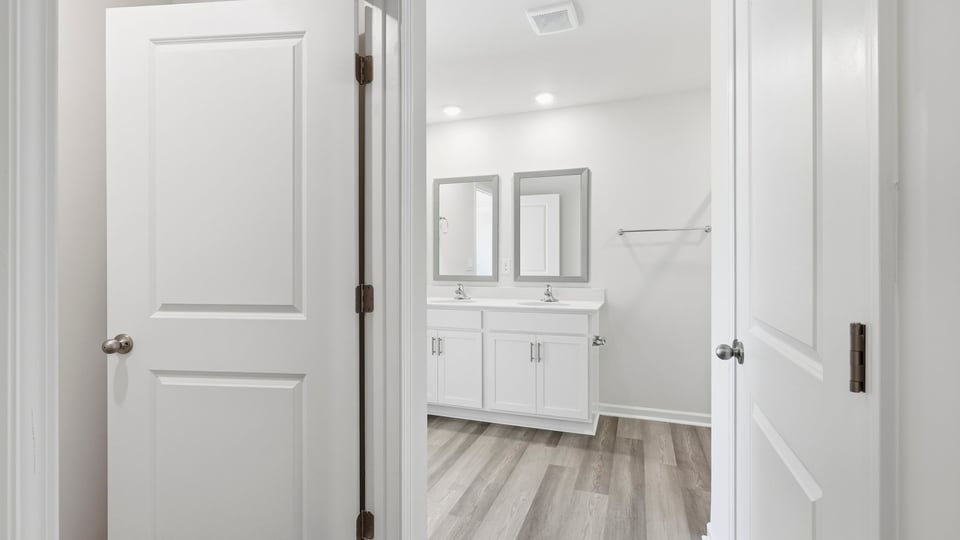 Primary bathroom with double vanity sinks.