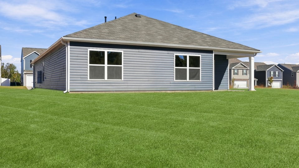 Back exterior with large backyard.