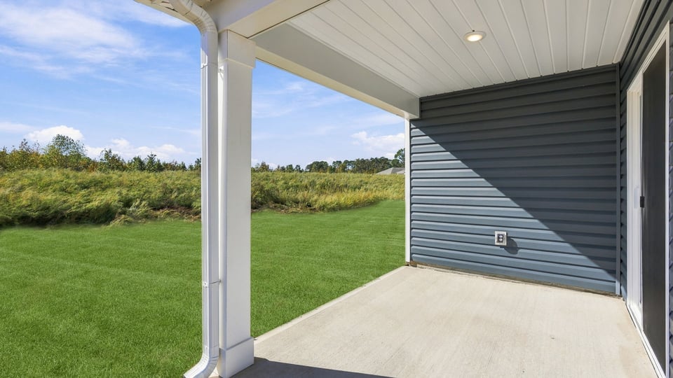 Back exterior with large backyard.
