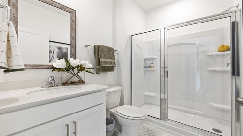 Bathroom with vanity sink and shower.