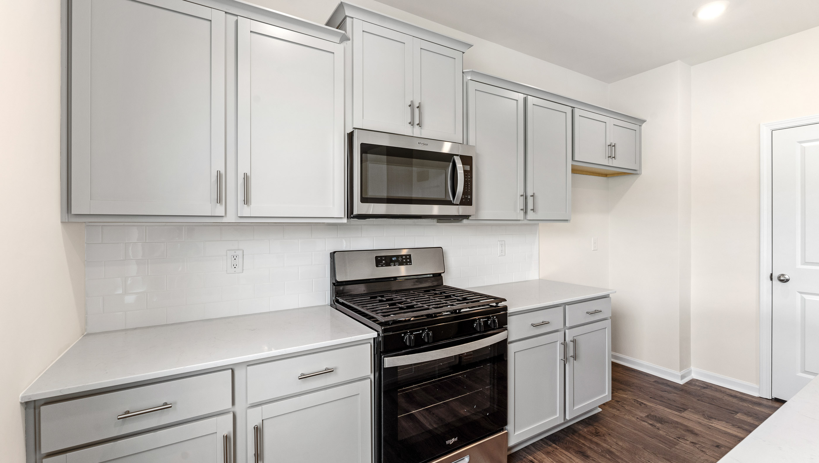 Kitchen features stainless steel appliances.
