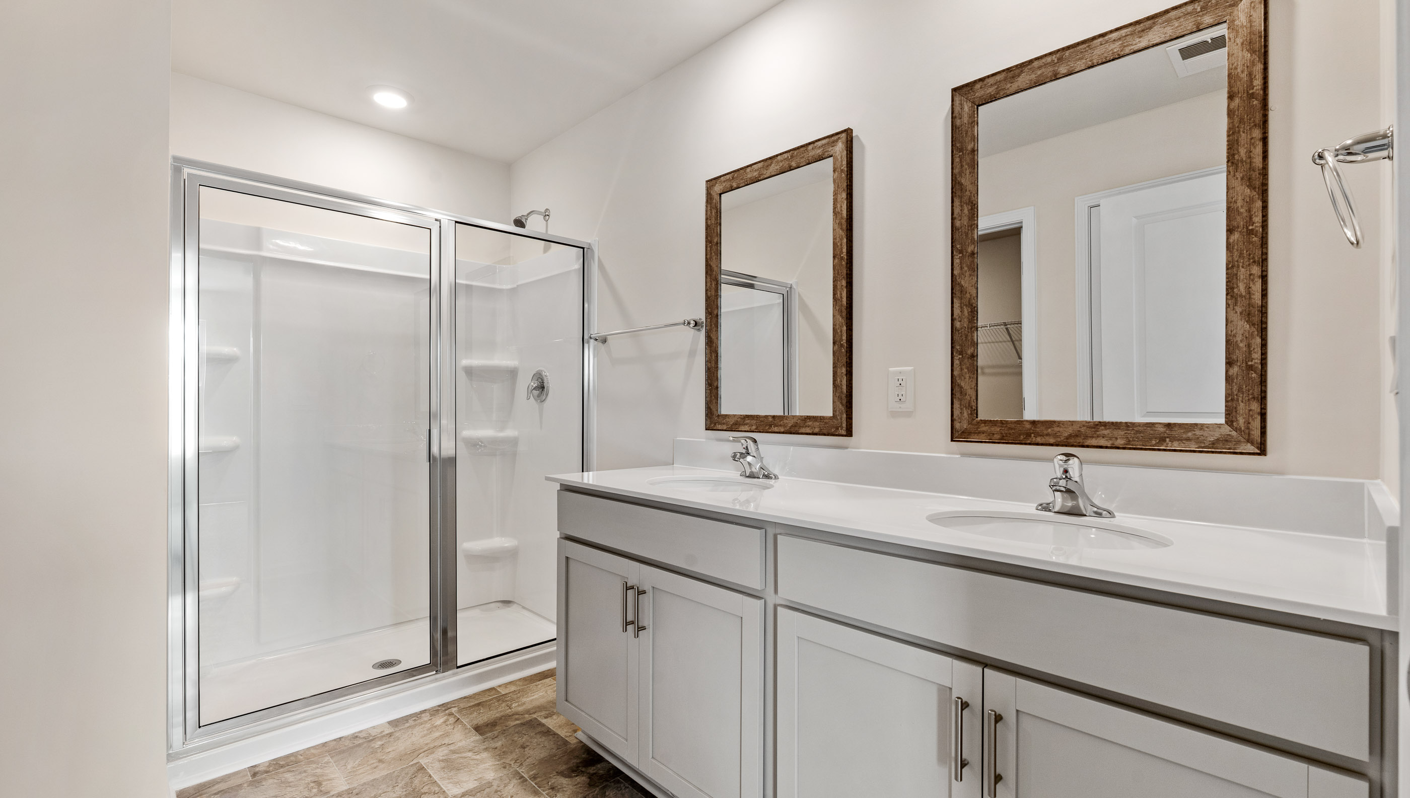 Primary bath with walk in shower and dual sink vanity