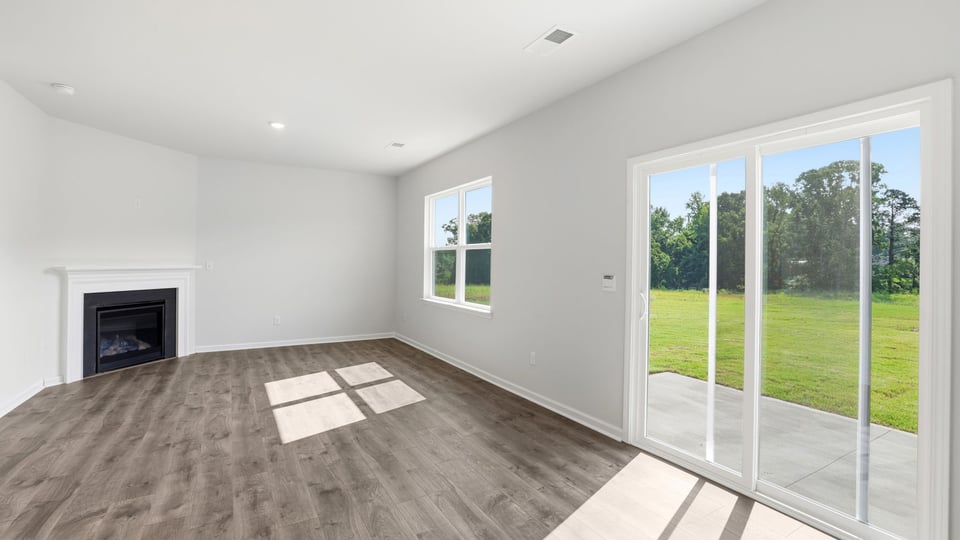 Family room with windows and fireplace.