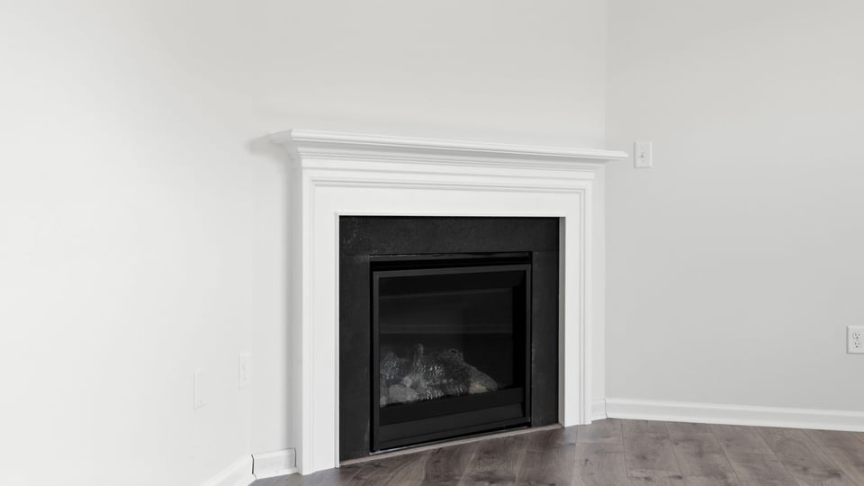 Family room with windows and fireplace.