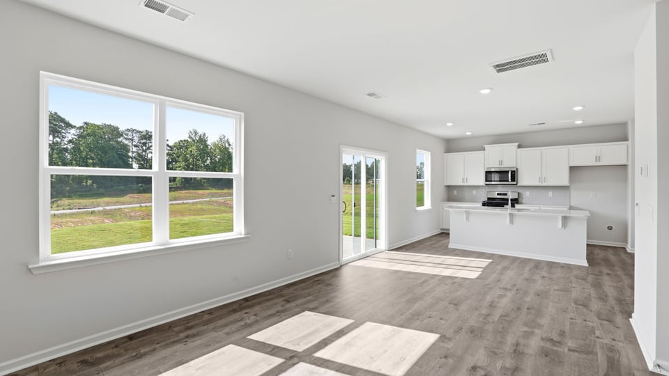 Family room with windows and fireplace.