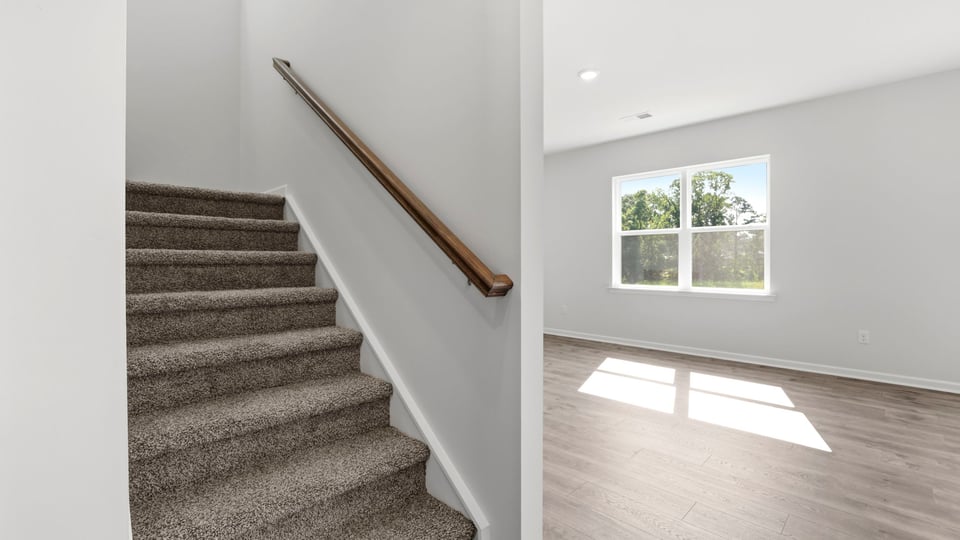 View of stairs to bedroom.
