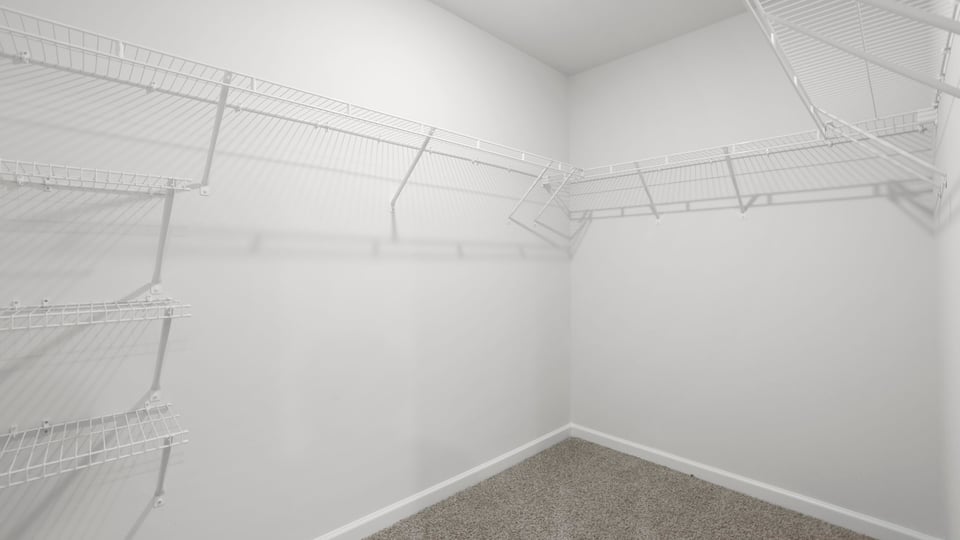 Closet with hanging storage racks.