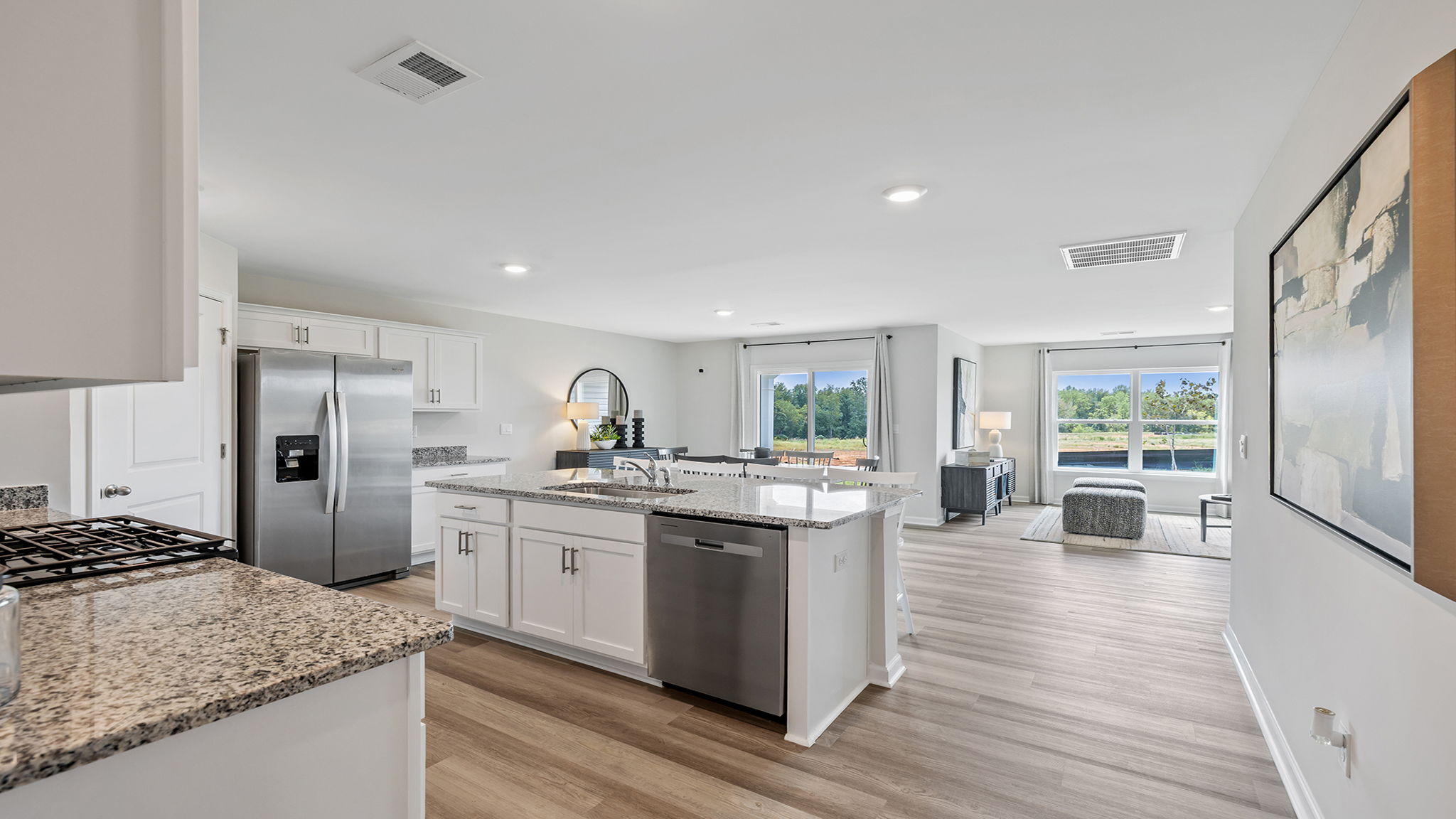 Kitchen with island and cabinets.