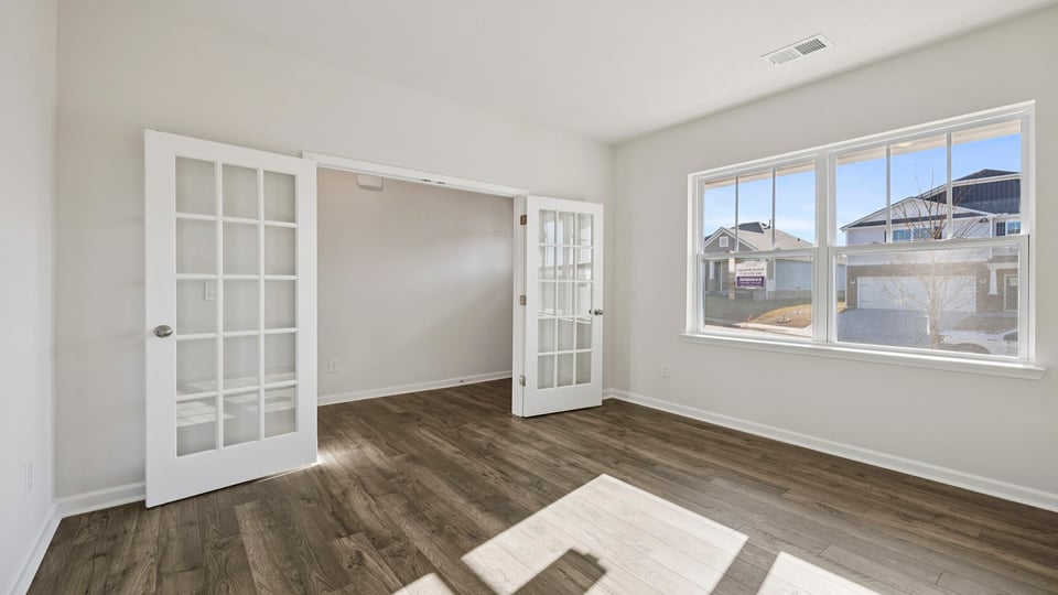 Study located at front of home with window.