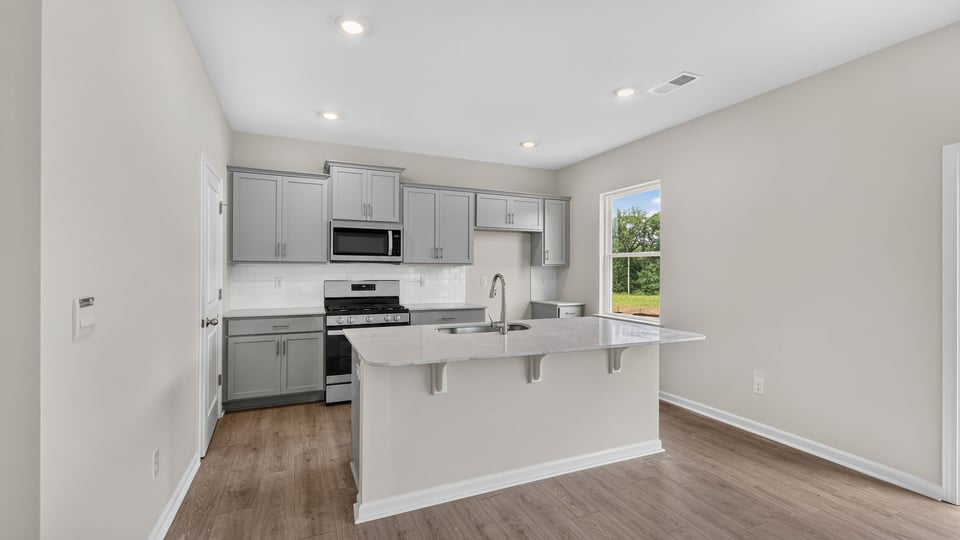 Kitchen and island with quarz countertops.