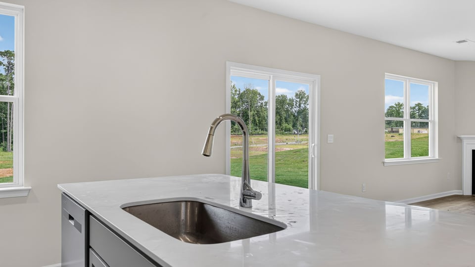 Kitchen and island with quarz countertops.