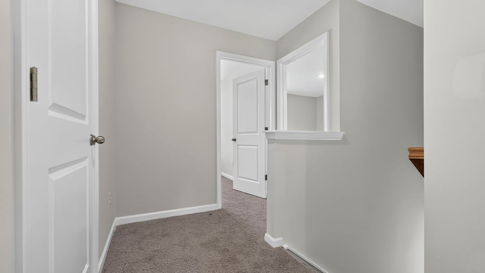 Loft area with carpet.