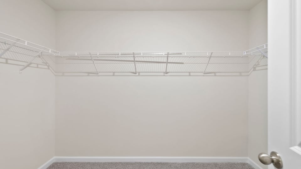 Closet with hanging storage racks.