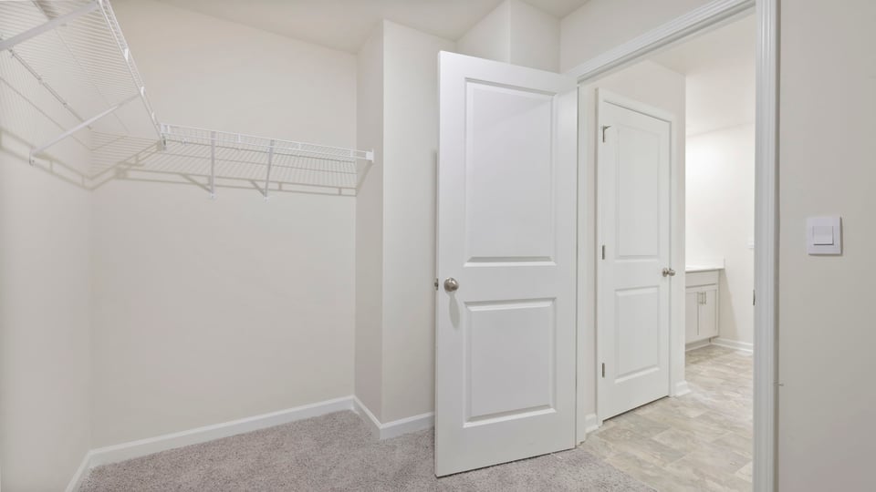 Closet with hanging storage racks.