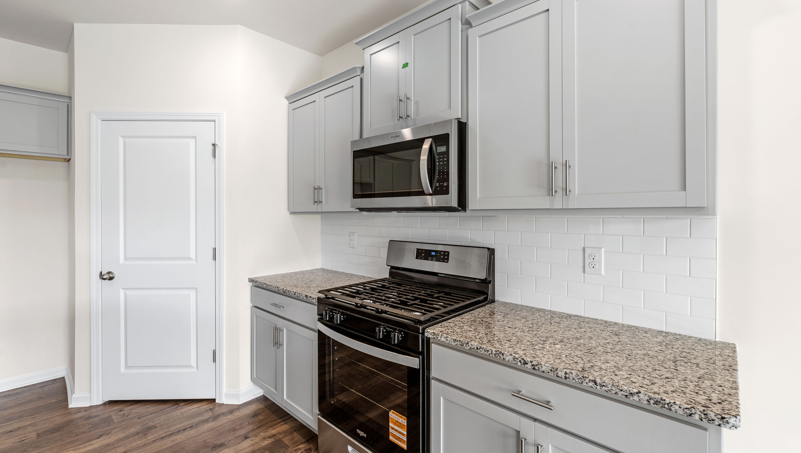 Kitchen with island and granite countertops.