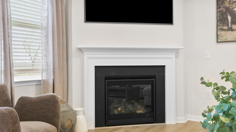 Living area with windows and fireplace.