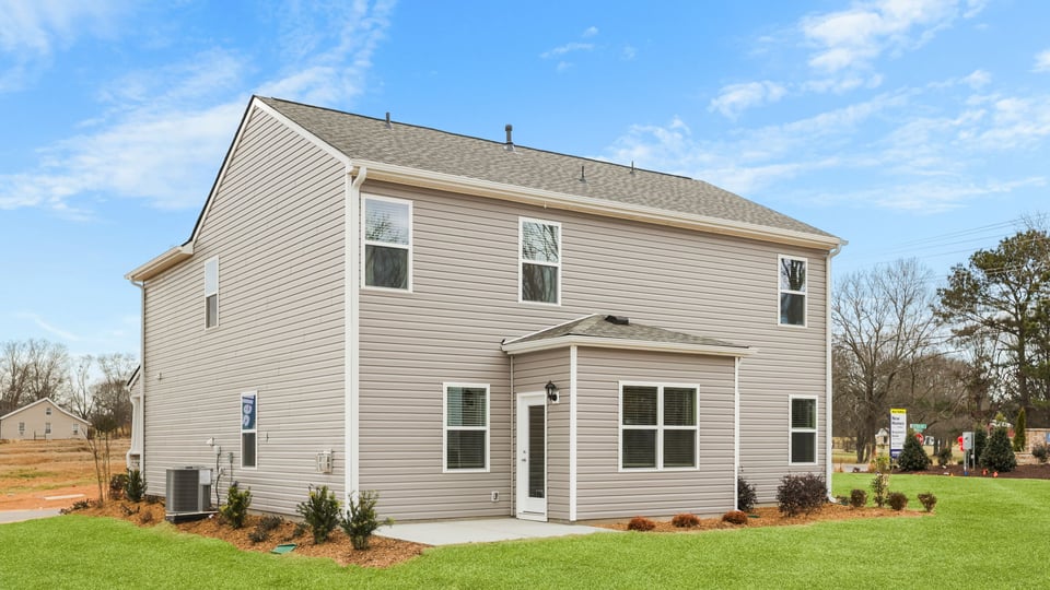 Back exterior with large backyard.