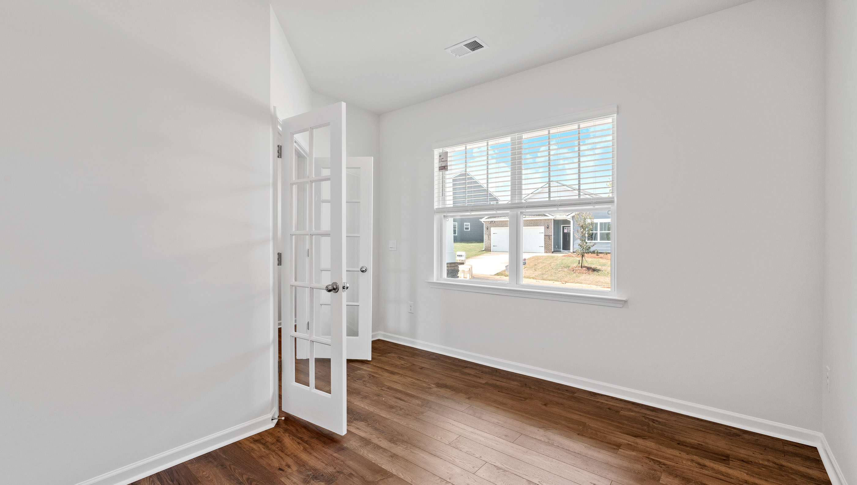 Flex room with French doors and window.