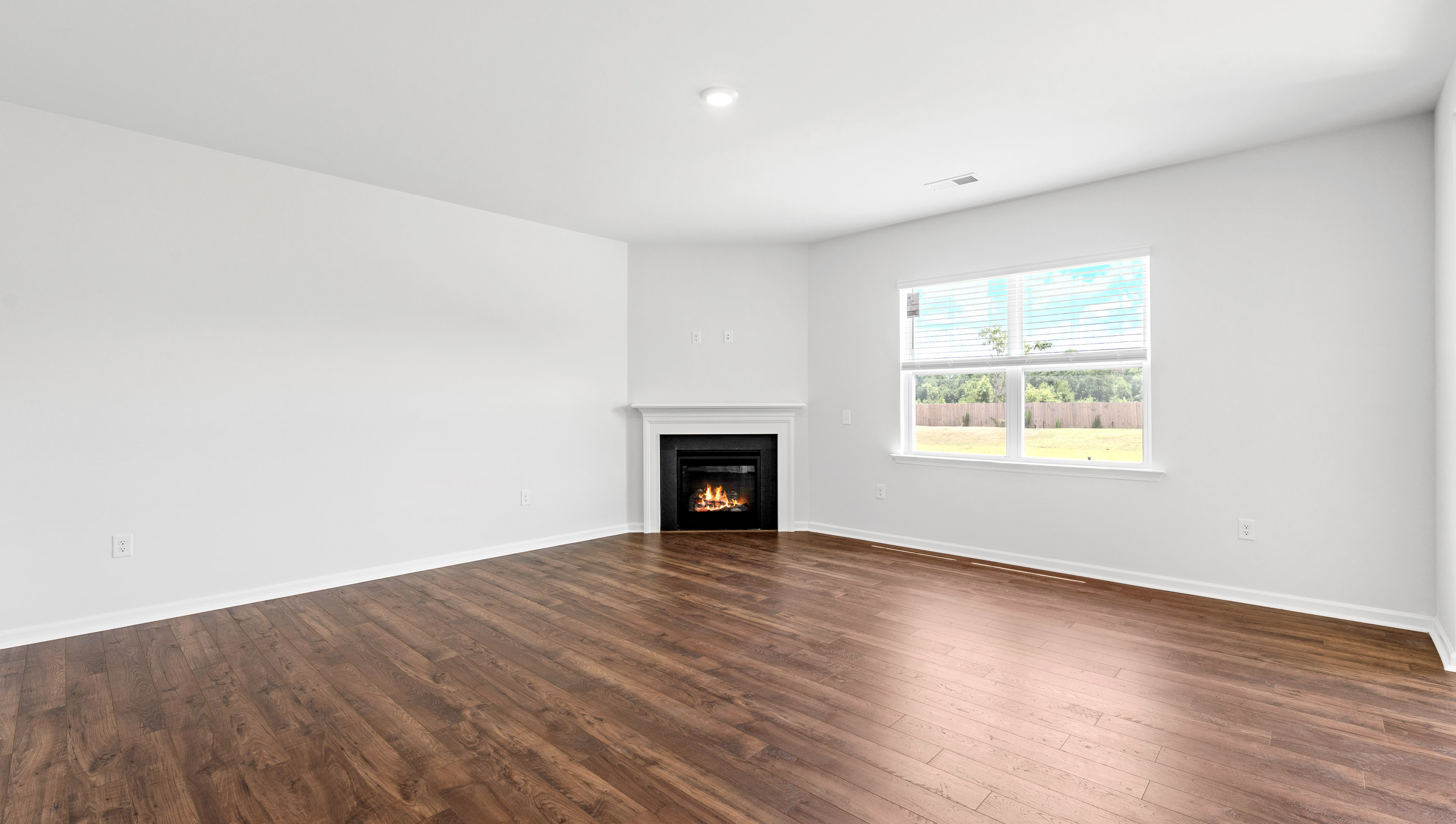 Living area with gas log fireplace.