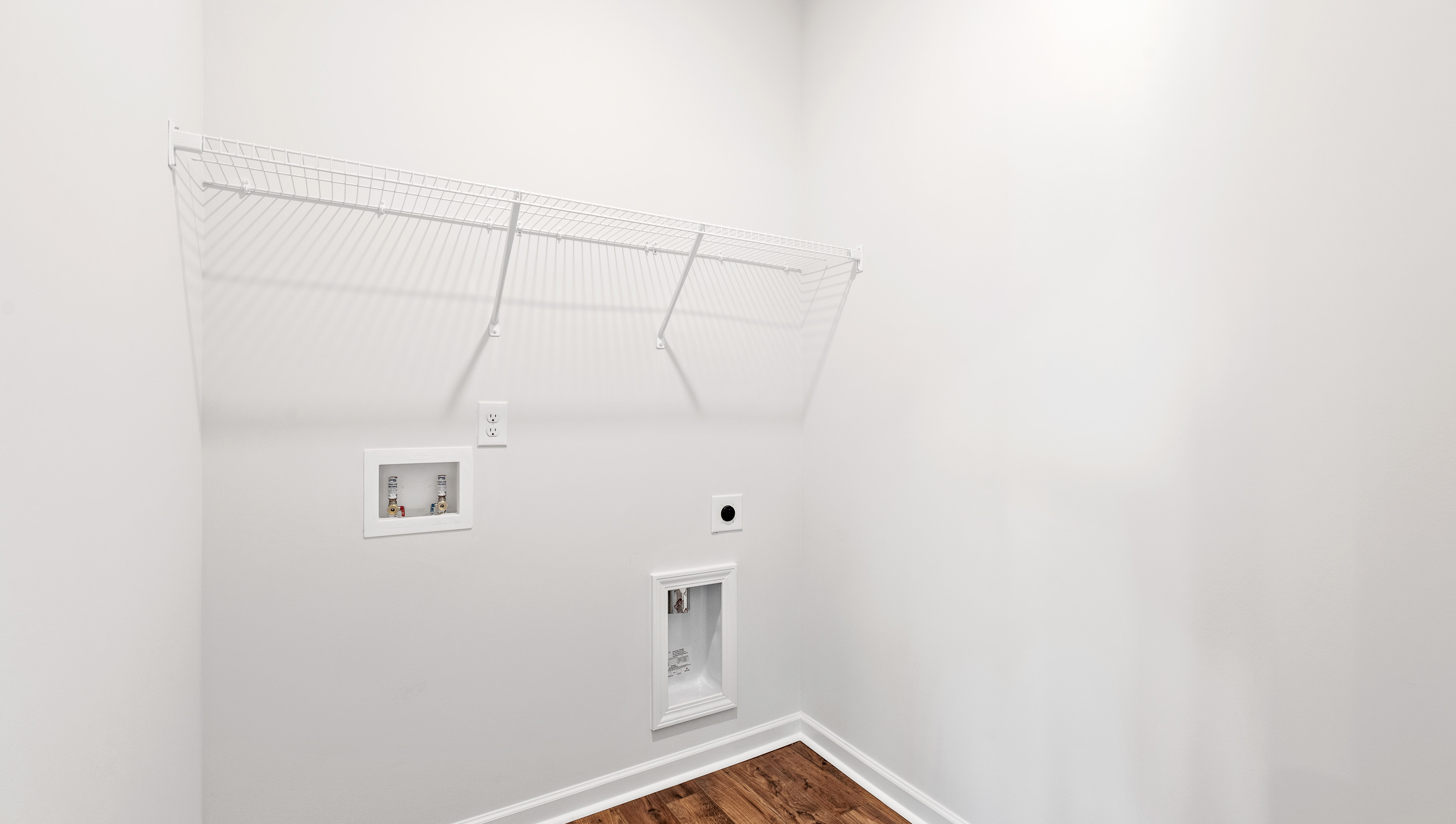 Laundry room with shelving.