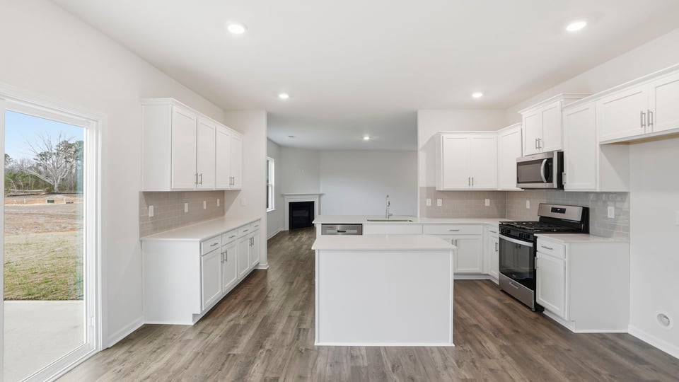 Kitchen with quartz countertops.