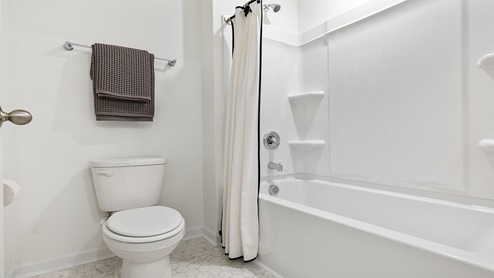 Bathroom with shower and tub combination.