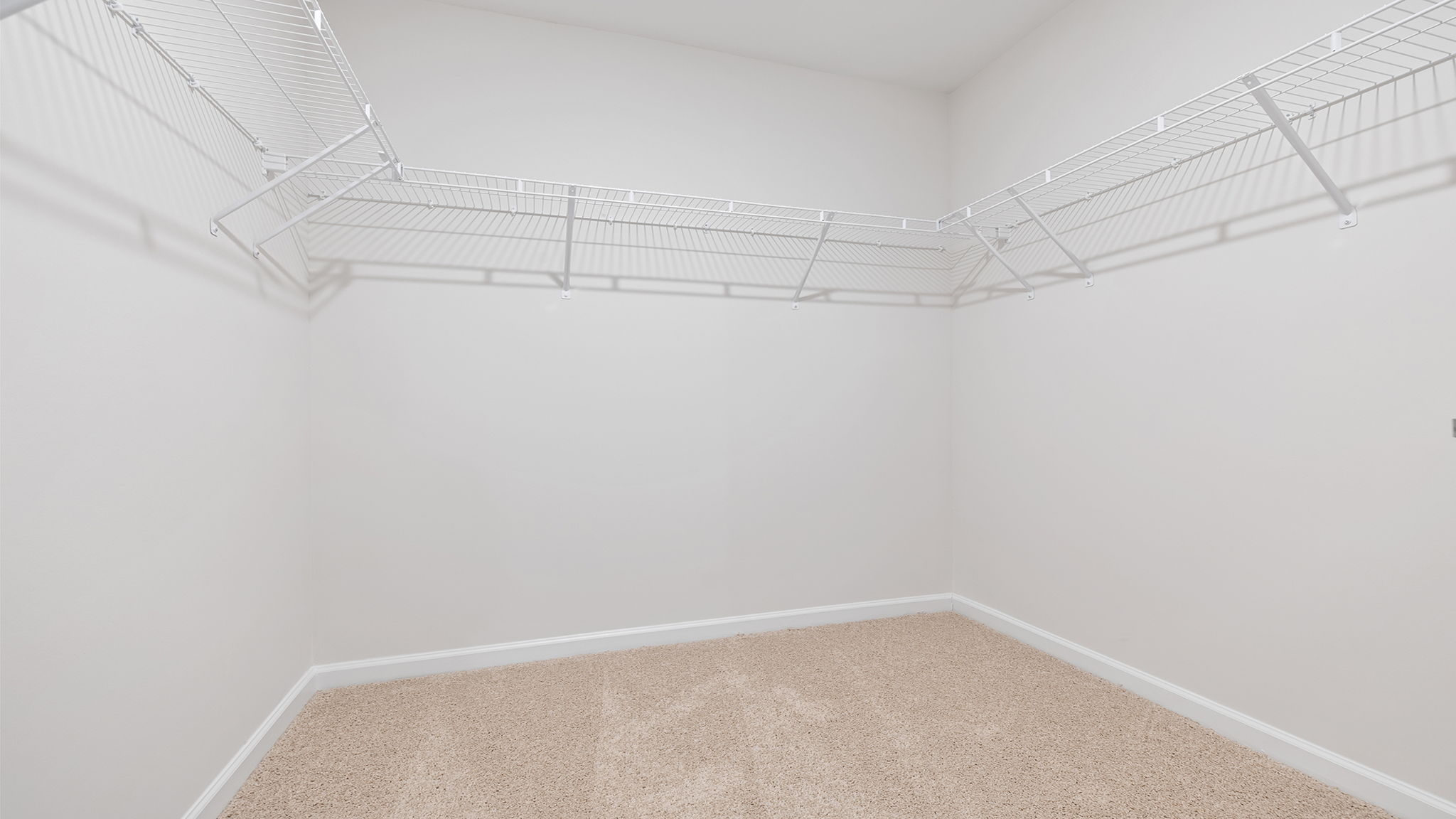 Primary closet with shelf.