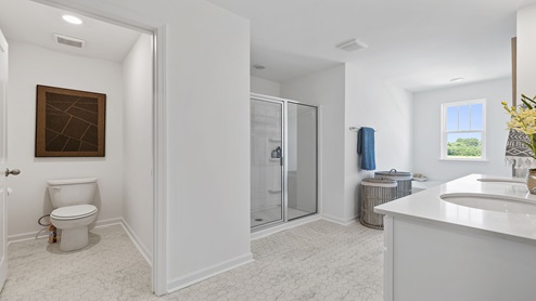 Primary bathroom with double vanity sinks.