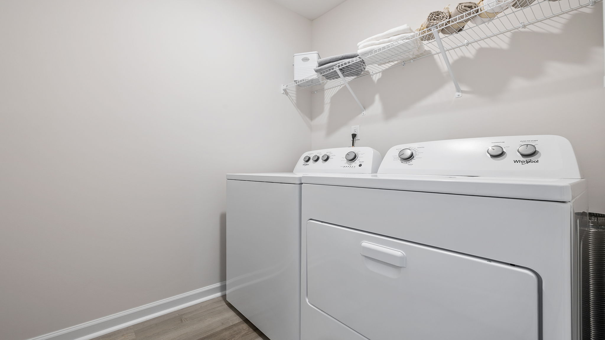 Laundry room with shelf.