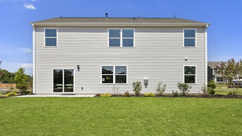 Back exterior with large backyard.