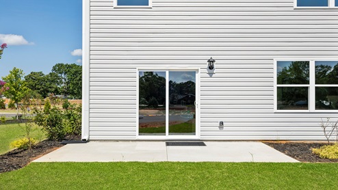 Back exterior with patio area.