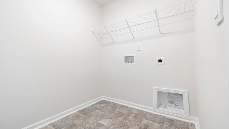 Walk in laundry with shelves.