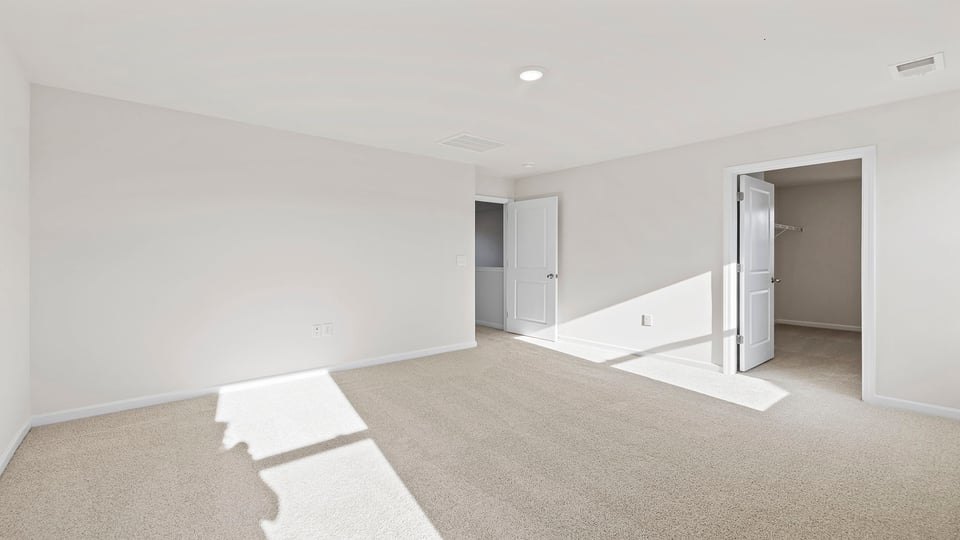 Bedroom with carpet.