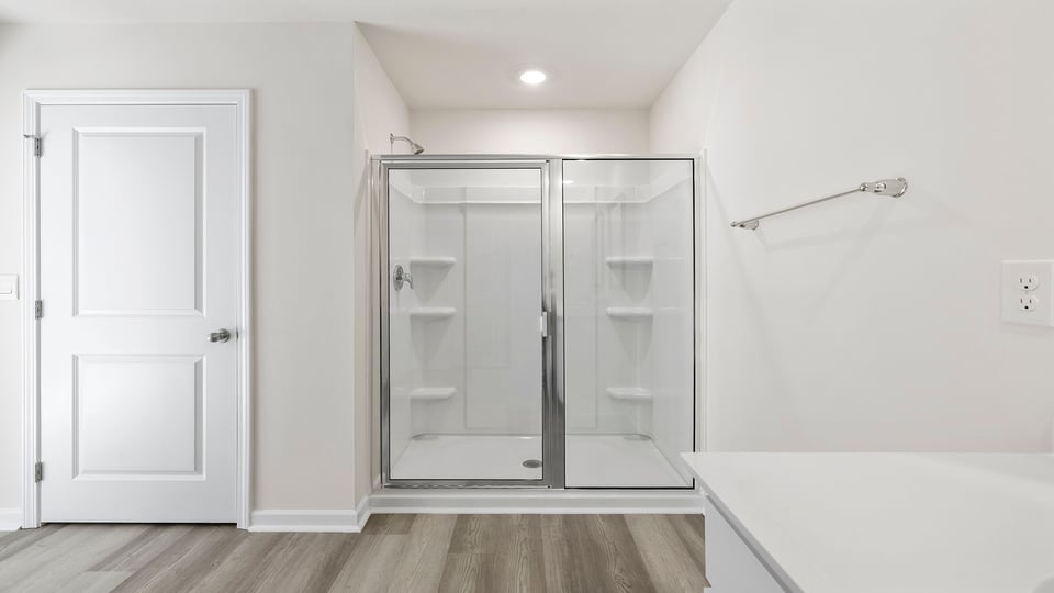 Bathroom with walk in shower.