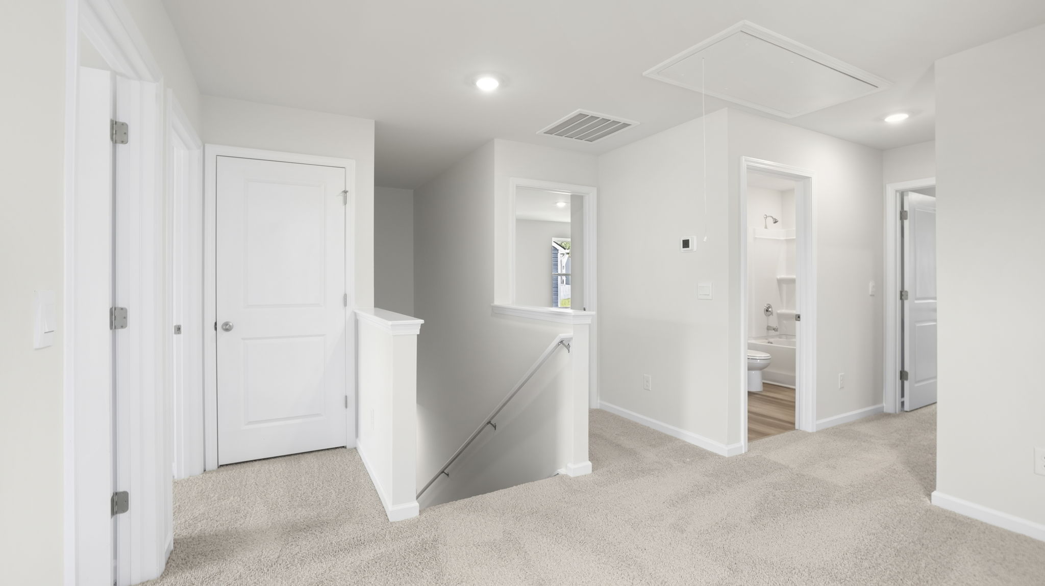 View of loft at top of staircase.