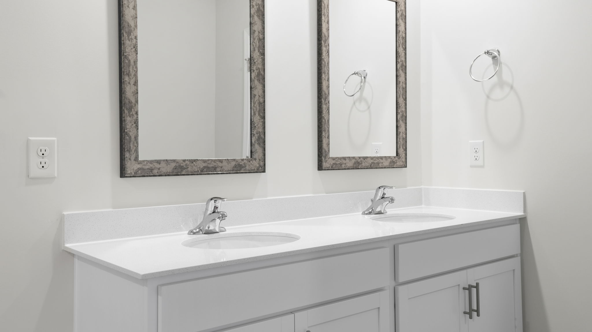 Primary bathroom with dual sink vanity.