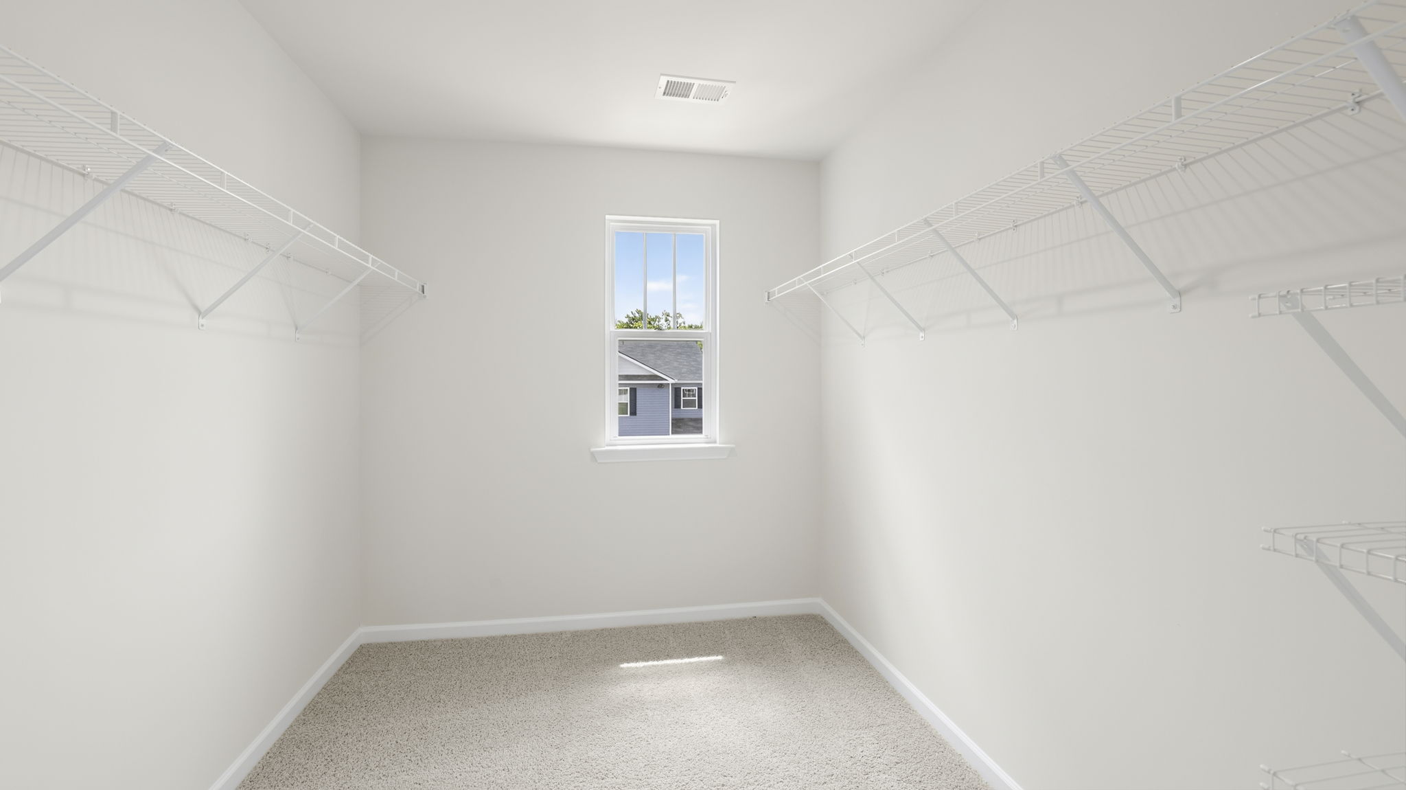 Primary bedroom walk-in closet.