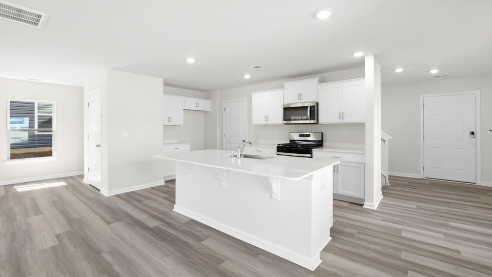Kitchen with island and countertops.