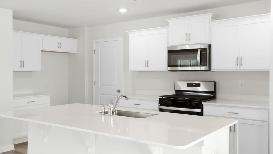 Kitchen with island and countertops.