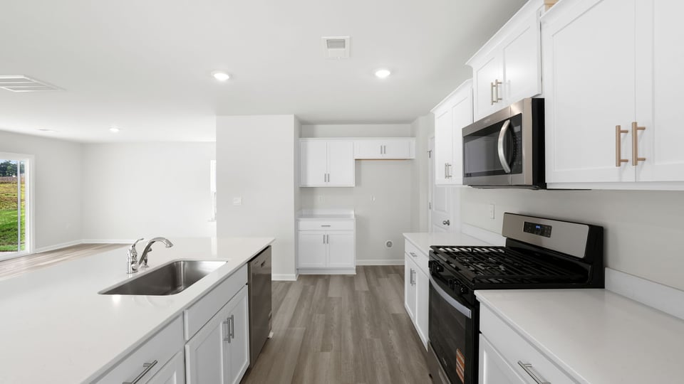 Kitchen with island and countertops.