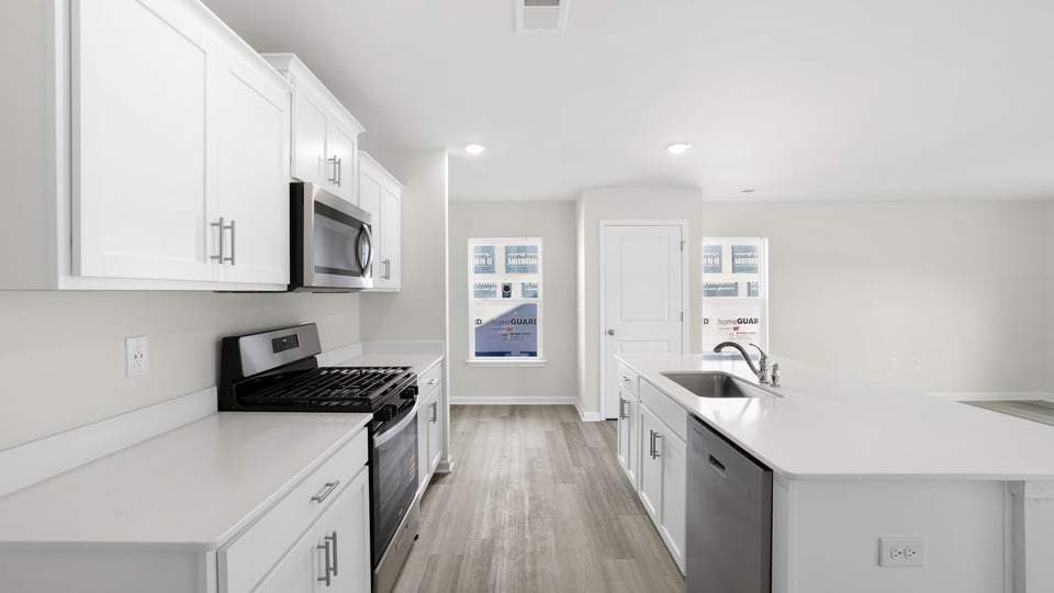Kitchen with island and countertops.