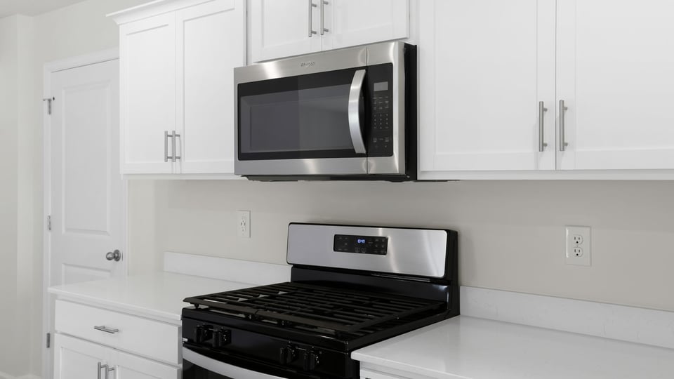 Kitchen with island and countertops.