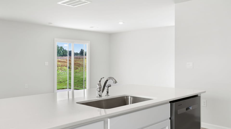 Kitchen with island and countertops.