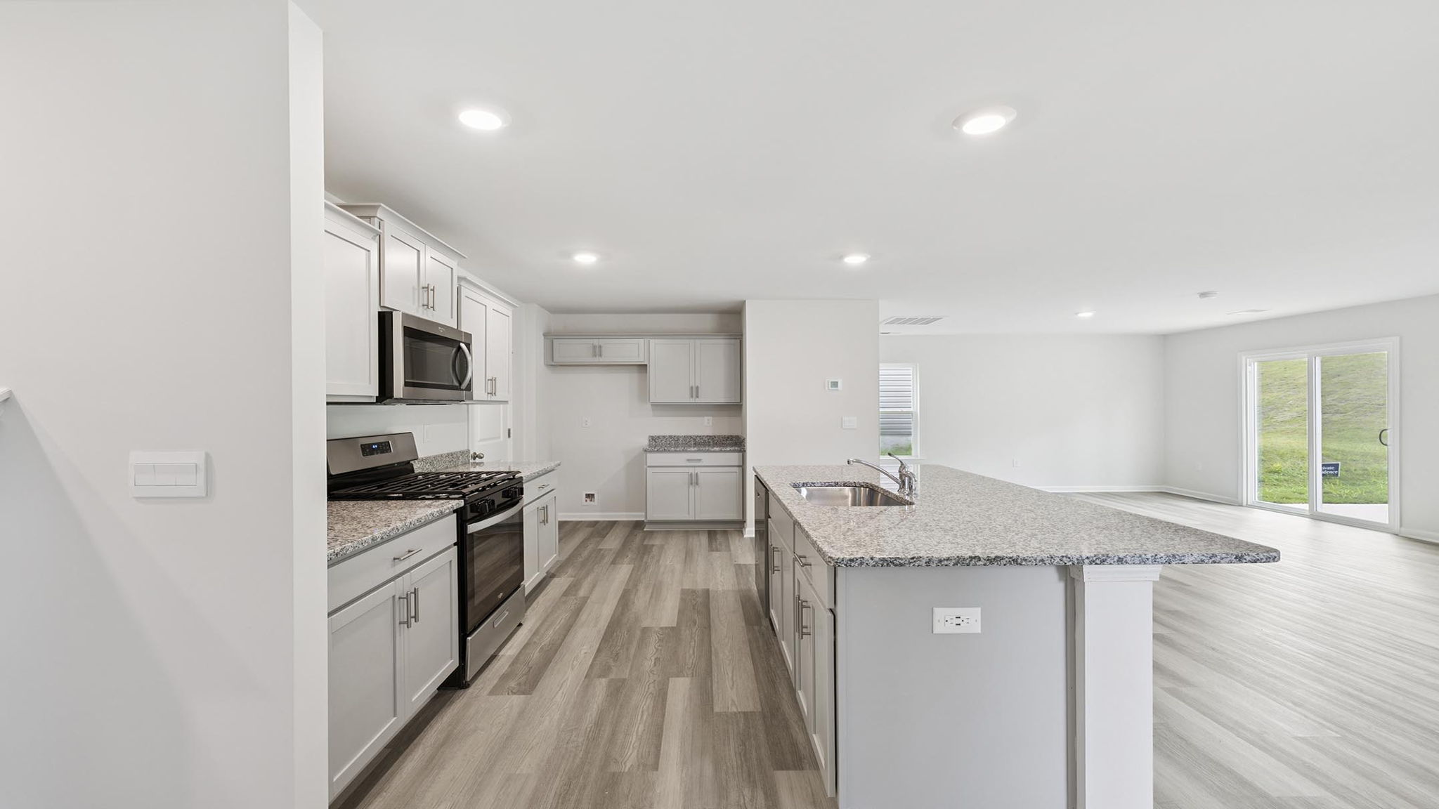 Kitchen with quartz countertop.