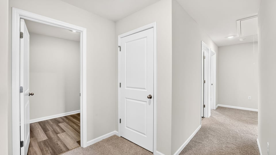 Bedroom with carpet and window.