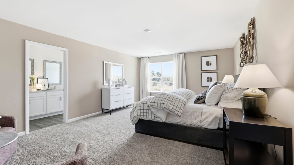 Bedroom with carpet and window.