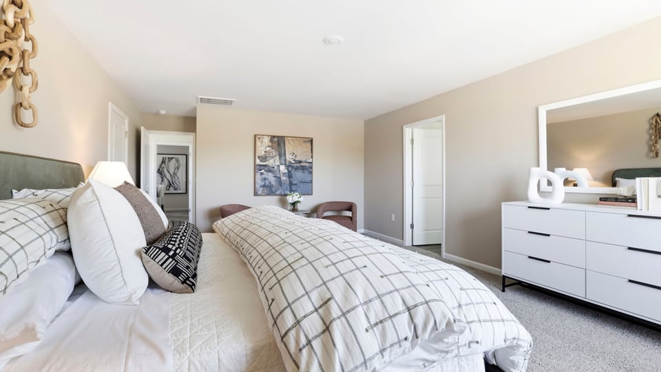 Bedroom with carpet and window.
