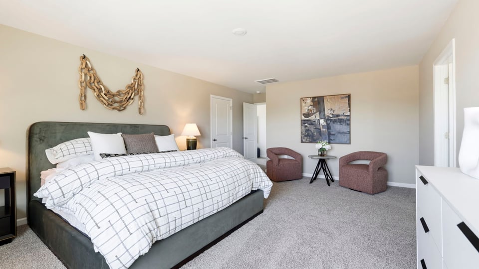 Bedroom with carpet and window.
